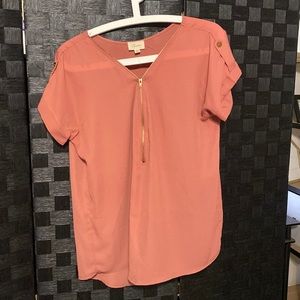 coral color, 3 quarter zipper on the front, size medium, semi sheer.